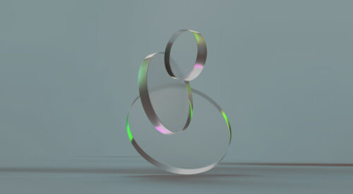 3D rendered round shapes in transparent material on a light back